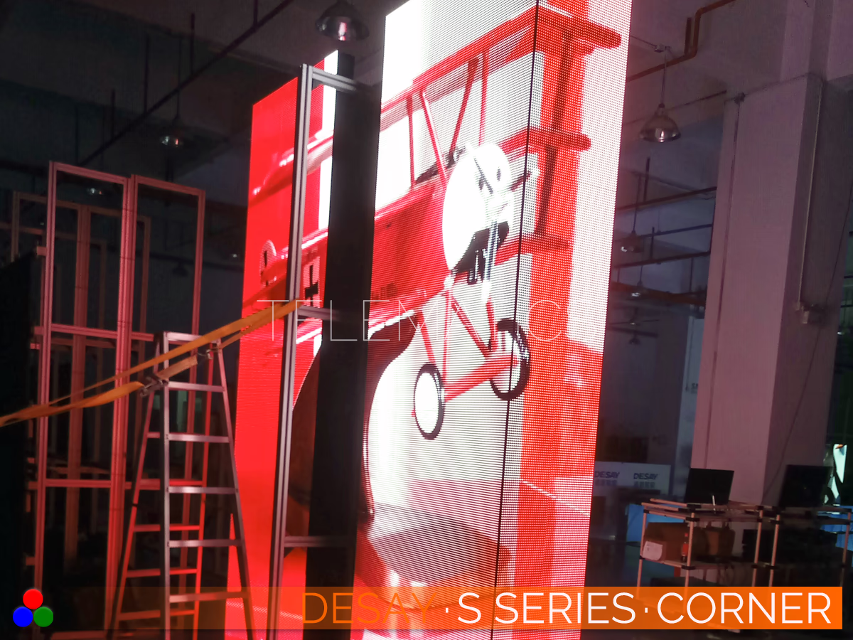 The Art Of LED · Desay S Series · Telematics Canada Desay S Series outdoor LED corner display assembly showing vibrant red test patterns and the structural support frame for right-angle fixed installations.