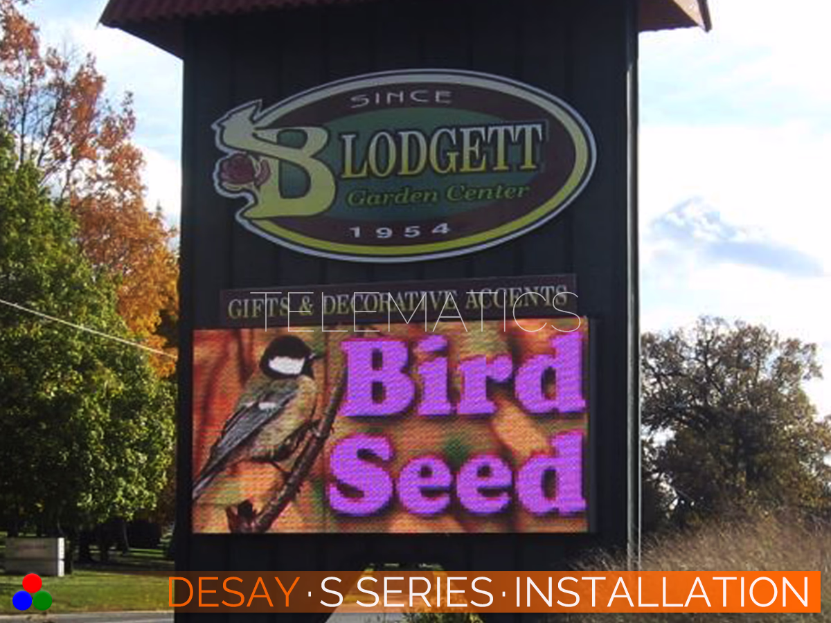 The Art Of LED · Desay S Series · Telematics Canada Desay S Series outdoor LED reader board installed on a garden center pylon sign featuring vivid color reproduction for retail promotions.