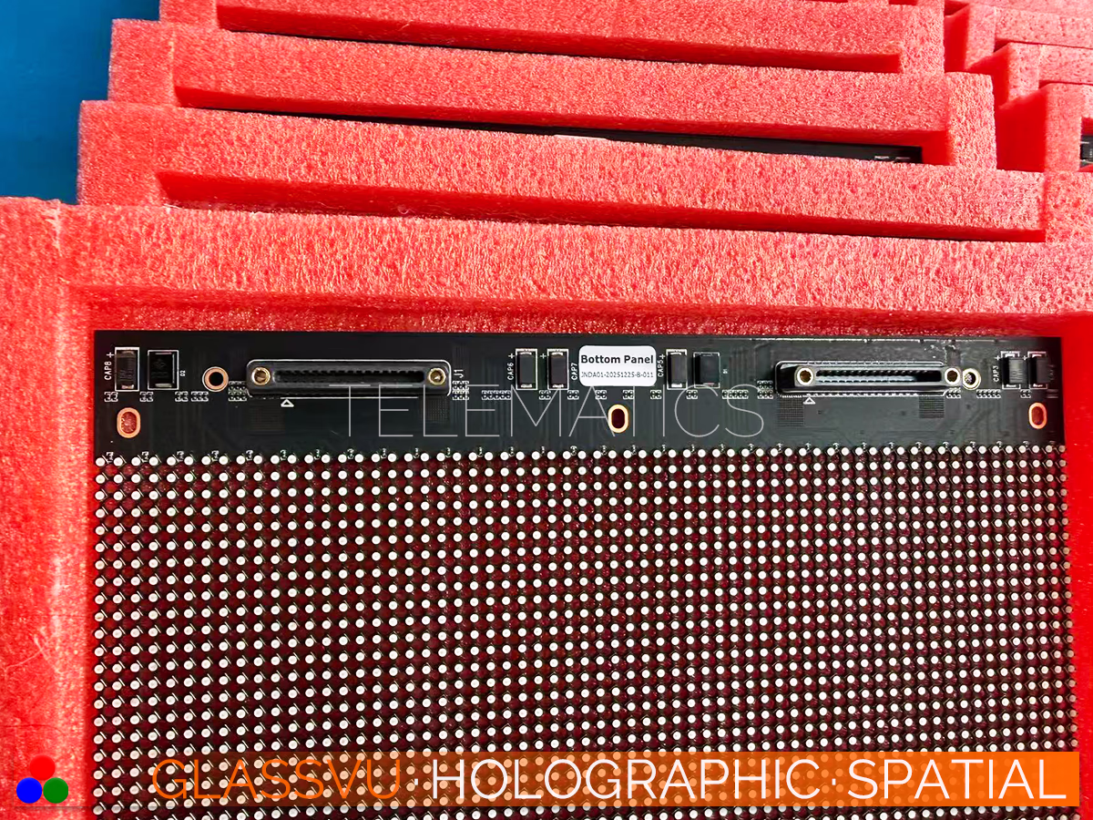 The Art Of Light · GlassVu Spatial · Telematics Canada High-transparency LED mesh module exposing integrated circuit boards packed securely in red shipping foam.